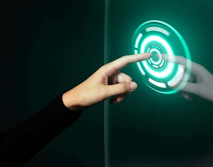 Hand touching a glowing digital interface, representing RixDigi's vision for AI-driven business